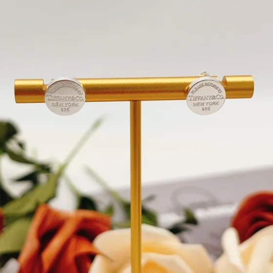 Tiffany Co Return to Tiffany earrings sterling silver with navy blue enamel 10mm diameter