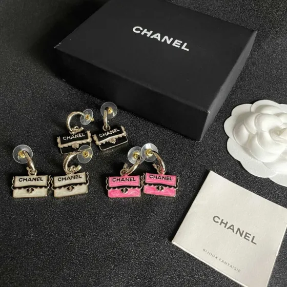 Chanel CC Logo Handbag Charm Drop Earrings earrings Gold-tone metal with pink enamel black enamel lettering and trim silver-tone turnlock detail 1 5cm hoop diameter 2cm total drop length