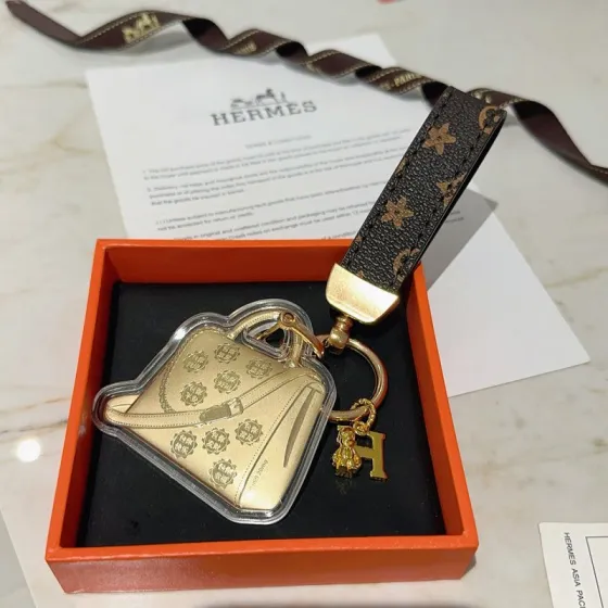 Hermes Bolide Bag Charm Keychain pendant Gold-tone metal dark brown monogram coated canvas clear acrylic casing 12cm total length