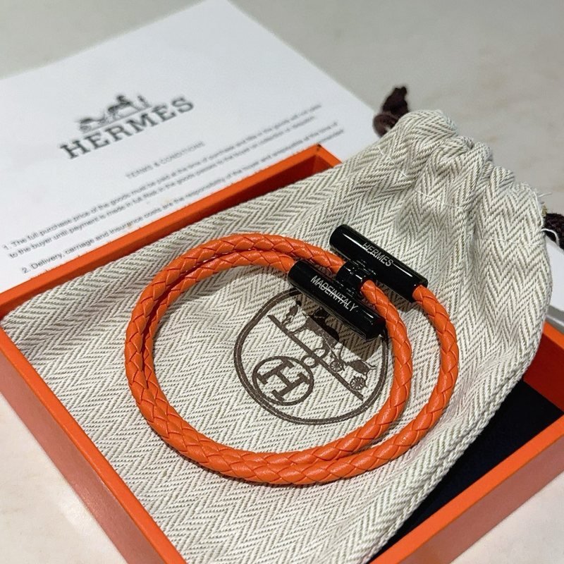 Hermes Tournis Tresse bracelet Orange braided leather with black metal hardware 19cm