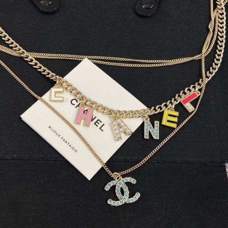 Chanel CHANEL Letter CC Logo Layered Necklace necklace Gold-tone metal with white pink yellow red enamel white faux pearls light blue crystal accents 42cm