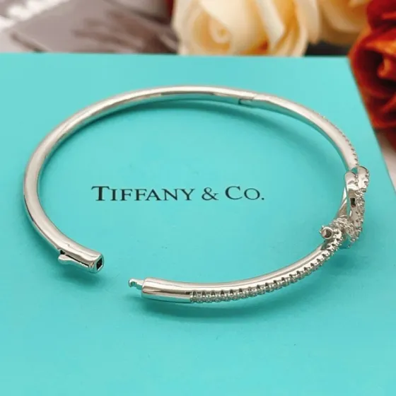 Tiffany Co Knot bracelet silver-toned metal with clear diamond-like accent stones 17cm inner circumference