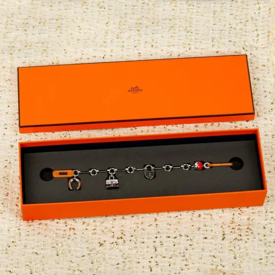 Hermes Bijou de Birkin N 1 bracelet Silver-toned metal with orange leather accents red enamel detail silver charms 17cm