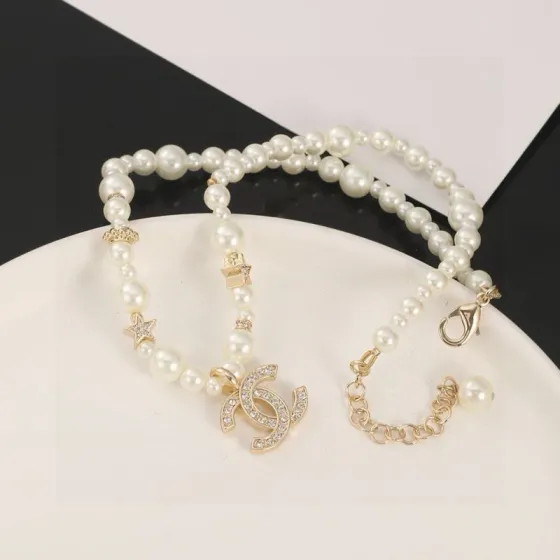 Chanel CC Logo Pearl Star Choker necklace Gold-tone metal white faux pearl clear crystal 40cm with 5cm extender chain
