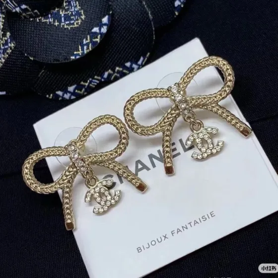 Chanel CC Logo Bow Drop Earrings earrings Light gold-tone metal with clear crystal accents One Size