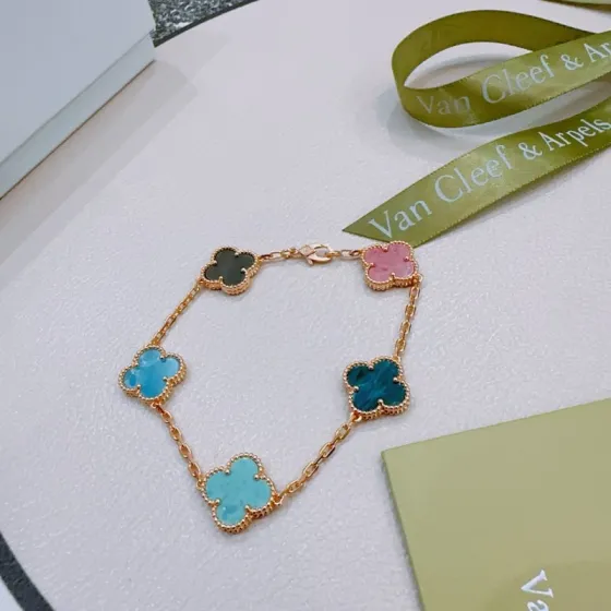 Van Cleef Arpels Vintage Alhambra bracelet Rose gold metal with multicolor clover stones including dark gray pink light sky blue teal blue and turquoise 18cm