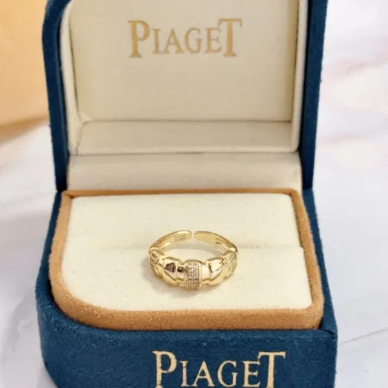 Piaget Possession ring yellow gold with clear diamond accents adjustable open band