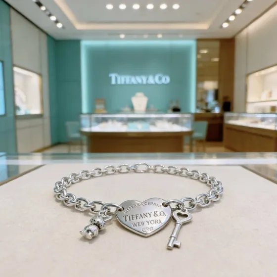Tiffany Co Return to Tiffany Heart Tag with Key and Rabbit Charm bracelet sterling silver with Tiffany Blue enamel accents 7 inches