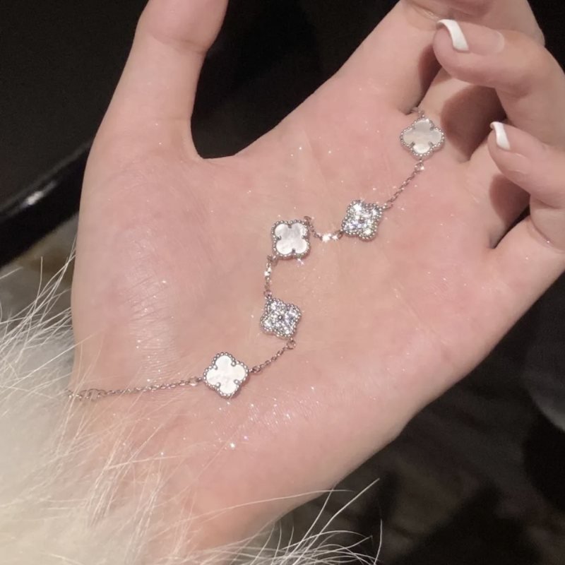Van Cleef Arpels Alhambra bracelet Silver-toned metal with white mother-of-pearl and clear diamond accents Gold-toned metal with white mother-of-pearl and clear diamond accents Gold-toned metal with pink mother-of-pearl and clear diamond accents 17cm