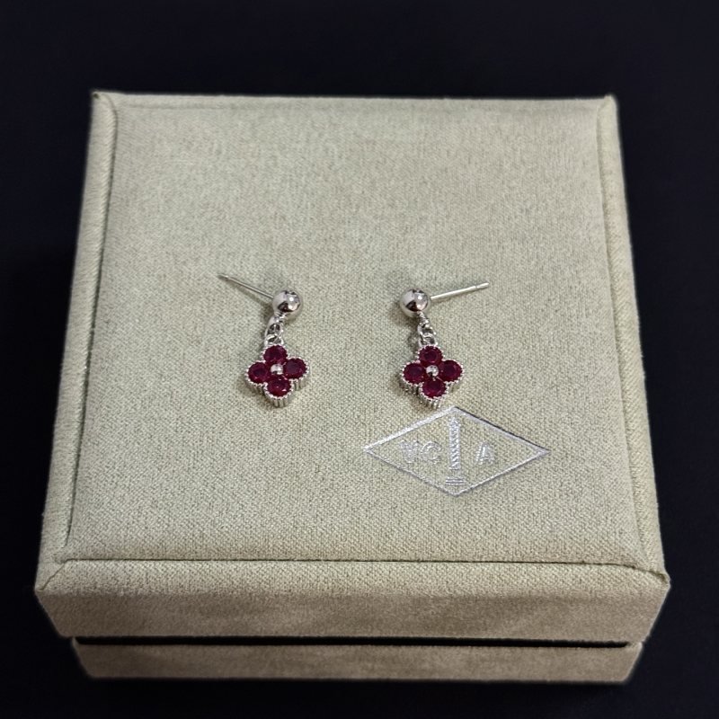 Van Cleef Arpels Alhambra earrings silver-toned white gold metal with deep ruby red gemstones and small white diamond accent 1 5cm drop length