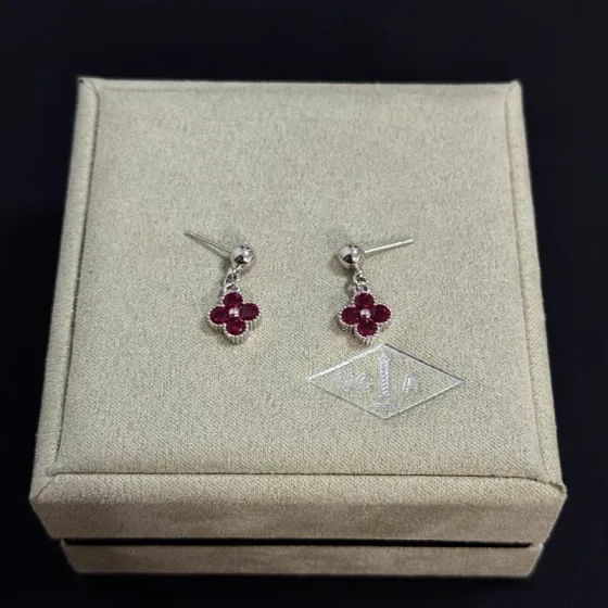 Van Cleef Arpels Alhambra earrings silver-toned white gold metal with deep ruby red gemstones and small white diamond accent 1 5cm drop length