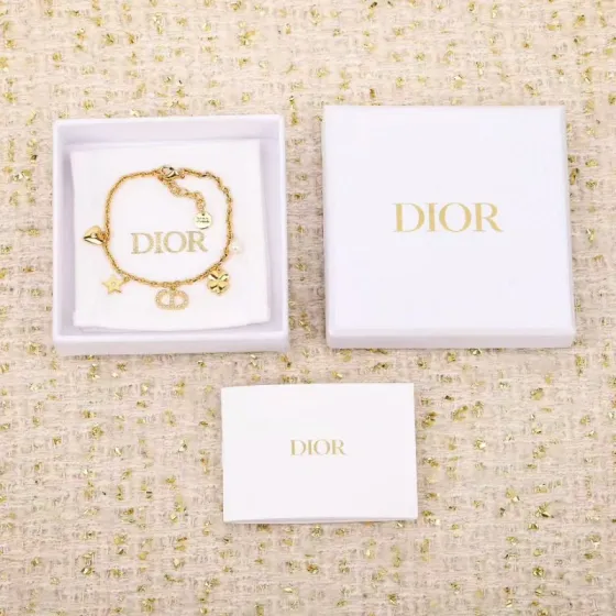 Dior Petit CD Lucky Charms bracelet Gold-tone metal with clear crystal accents and white faux pearl charm 17cm