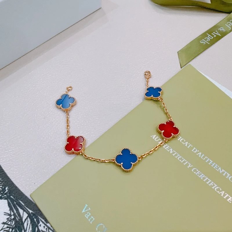 Van Cleef Arpels Alhambra bracelet Gold-toned metal with blue and red clover inlays 17cm