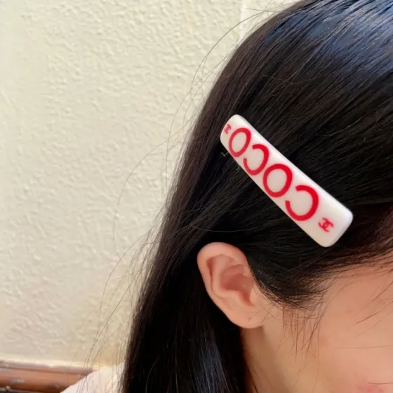 Chanel COCO brooch white base with red printed logos and text 6cm