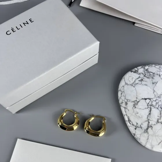 Celine Layered Hoop Earrings earrings Gold-tone metal one variant with navy blue enamel one variant in polished gold 2 5cm diameter