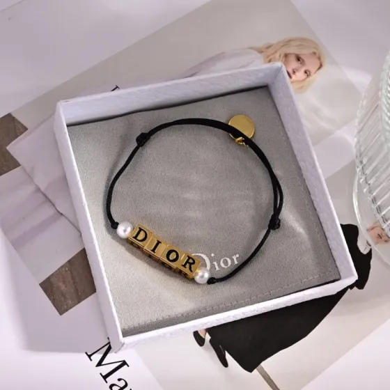 Dior D-Dice bracelet Black cotton cord gold-tone metal white resin pearl beads Adjustable sliding knot fits 15-19cm wrist