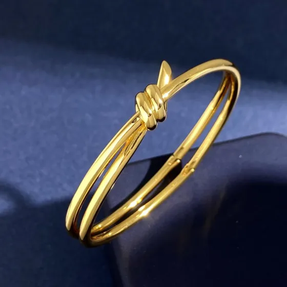 Tiffany Knot bracelet polished yellow gold polished silver-toned metal no gemstones 17cm inner circumference