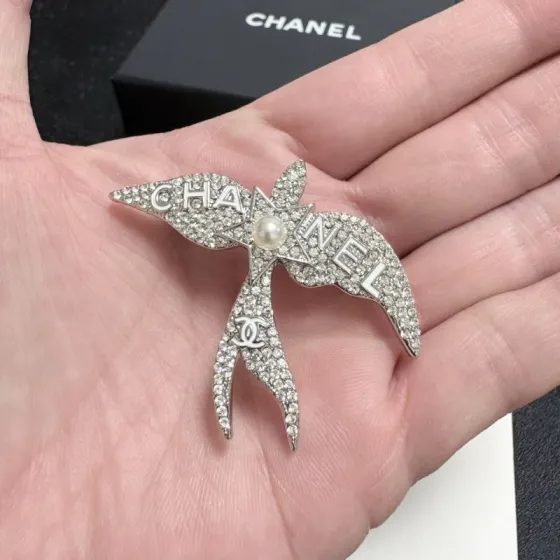 Chanel Crystal Pearl Swallow CC Logo Brooch brooch Silver-toned metal clear crystal white pearl Approximately 4 5cm width x 4cm height