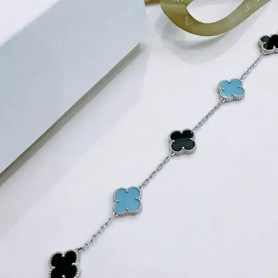 Van Cleef Arpels Alhambra bracelet Silver-toned metal with black onyx and turquoise blue clover inlays 18cm