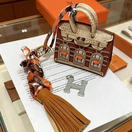 Hermes Birkin Faubourg Micro Bag Charm pendant Gold-tone metal brown beige orange leather orange brown beige silk clear crystal stones Total length 18cm