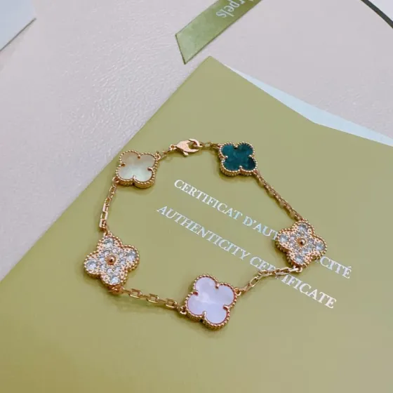 Van Cleef Arpels Alhambra bracelet Rose gold with white mother-of-pearl teal blue stone clear diamond accents and cream mother-of-pearl 17cm