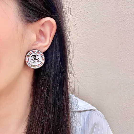 Chanel CC Logo Round Stud Earrings earrings Silver-tone metal with white enamel base black CC logo and text coral red and gold decorative accents faux pearl details 2cm diameter