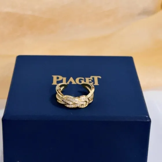 Piaget Possession Knot ring yellow gold with clear diamond accents adjustable open band