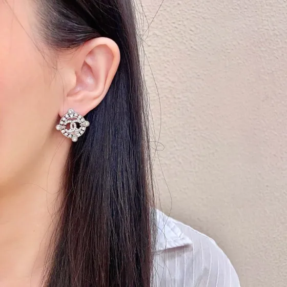 Chanel CC Logo Crystal Compass Stud Earrings earrings silver-toned metal with clear crystal accents 1 5cm diameter