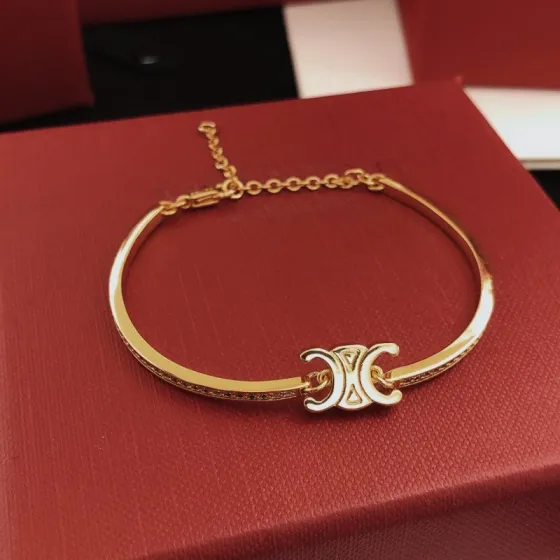 Celine Triomphe bracelet gold-tone metal with clear pave crystals 17cm with 3cm extension chain