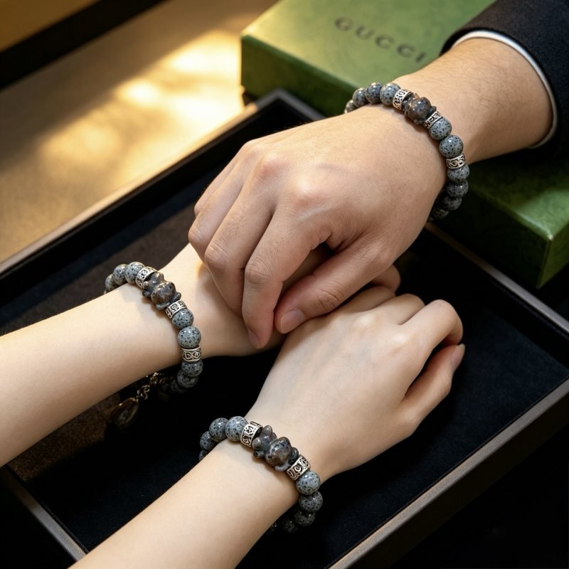 Gucci Anger Forest bracelet Antique silver-toned metal with grey speckled dalmatian stone beads and brownish-grey carved stone charm 18cm