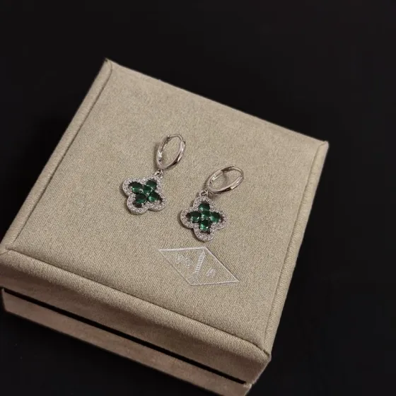 Van Cleef Arpels Alhambra earrings white gold with emerald green gemstones and clear diamond accents 12mm hoop diameter 10mm charm