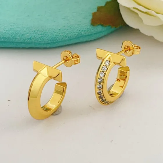Tiffany T1 earrings 18k yellow gold with clear diamond accents 15mm hoop diameter