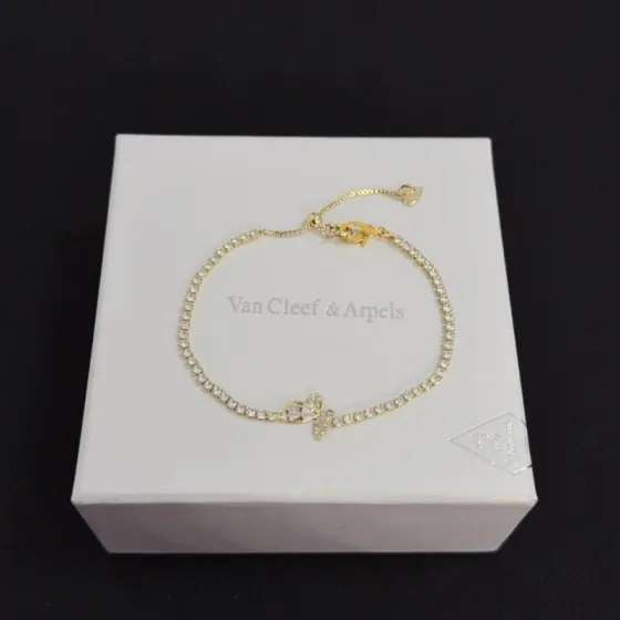 Van Cleef Arpels Alhambra bracelet gold-tone metal with clear diamond-like stones 18cm