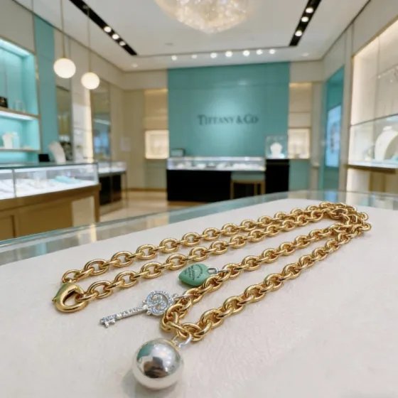 Tiffany Co Return to Tiffany Charms necklace gold-tone metal silver-tone metal turquoise blue enamel clear diamond accents 18 inches
