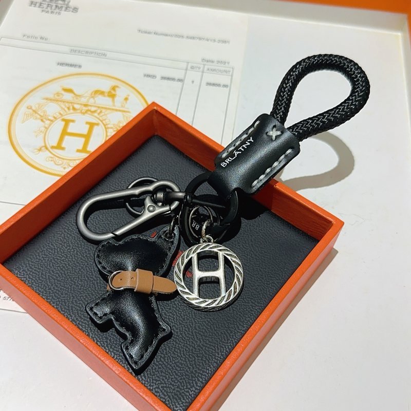 Hermes H Logo Bulldog Charm Keychain pendant gunmetal silver metal black braided cord black leather tan leather accent 10cm total length
