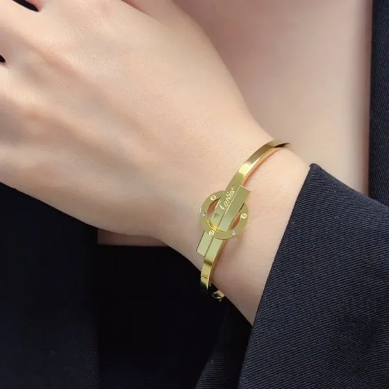 Cartier Love Interlocking Signature Bangle bracelet 18k yellow gold with diamond accents 18k white gold with diamond accents 17cm inner circumference