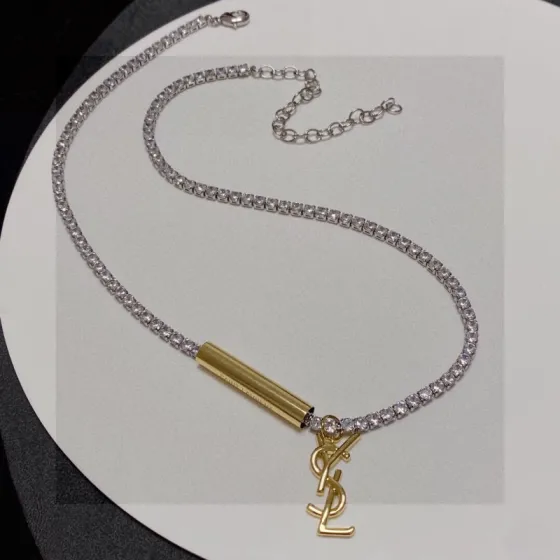 Saint Laurent Cassandre YSL Monogram Crystal Tennis Choker necklace Silver-toned metal with clear faceted crystals gold-toned metal logo and bar charm 40cm with 5cm extender chain
