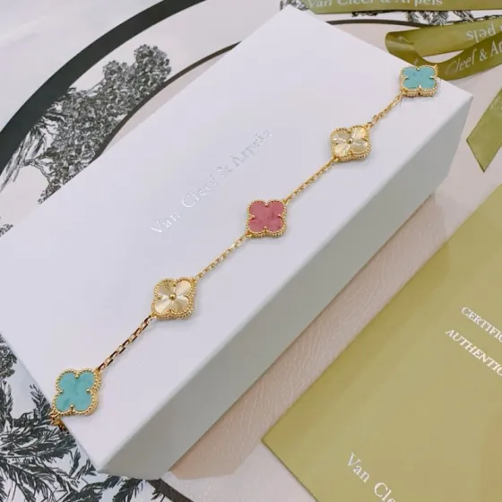Van Cleef Arpels Alhambra bracelet Yellow gold metal with turquoise blue rhodonite pink and golden guilloche clover motifs 19cm