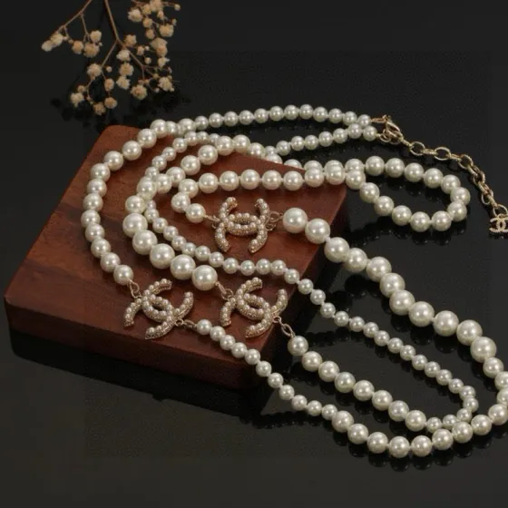 Chanel CC Logo Multi-Charm Pearl Long Necklace necklace Gold-tone metal cream white faux pearl clear crystal 80cm with 5cm extension chain