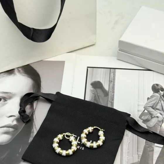 Celine Striped Enamel Hoop Earrings earrings gold-tone metal with white enamel stripes 2 5cm diameter