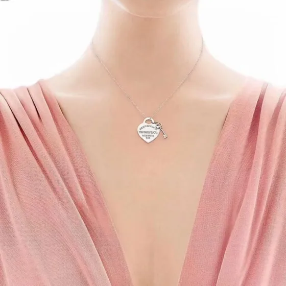 Tiffany Co Return to Tiffany Heart Tag with Key necklace Sterling silver 925 silver with polished silver finish no colored gemstones 18 inches