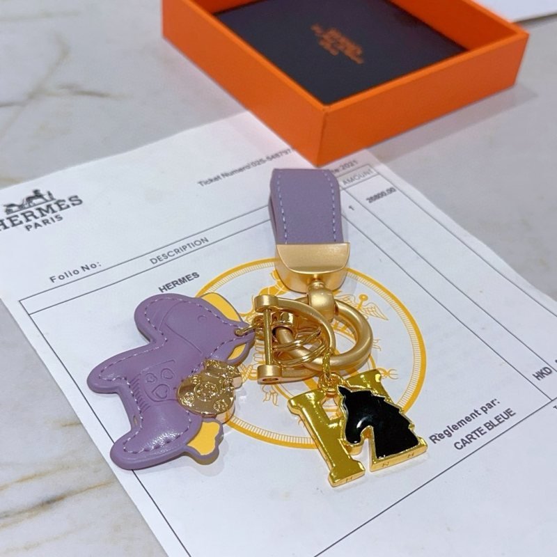 Hermes Rodeo Horse H Logo Key Charm pendant matte gold metal lavender purple leather yellow leather accent black enamel 10cm total length