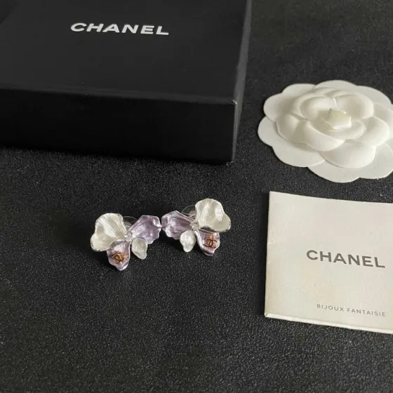 Chanel CC Logo Flower Stud Earrings earrings Silver-toned metal pearlescent white lavender purple rose gold CC logo white faux pearl accent One Size approx 2cm width per earring
