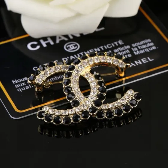Chanel CC Double C Logo Crystal Brooch brooch gold-tone metal with clear crystals and black faceted stones 3 5cm width