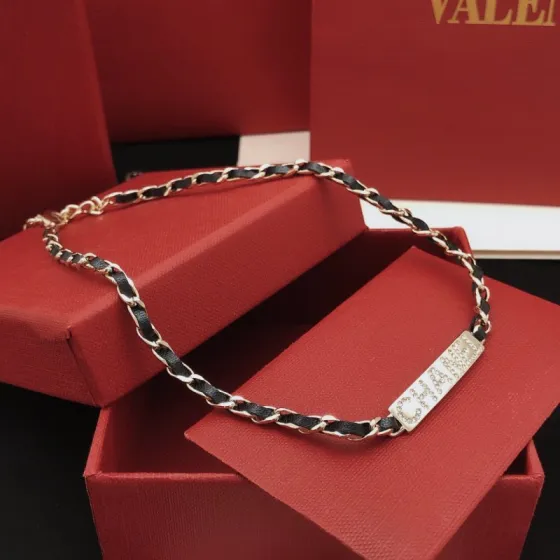 Chanel Leather Woven Chain Crystal Logo Plate Choker necklace Gold-tone metal black leather clear crystal 40cm with 5cm extender