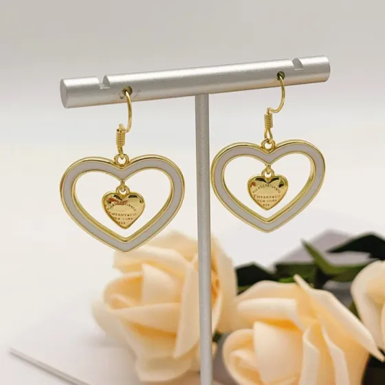 Tiffany Co Return to Tiffany Double Heart Dangle earrings gold-tone metal with white enamel 3 5cm drop length