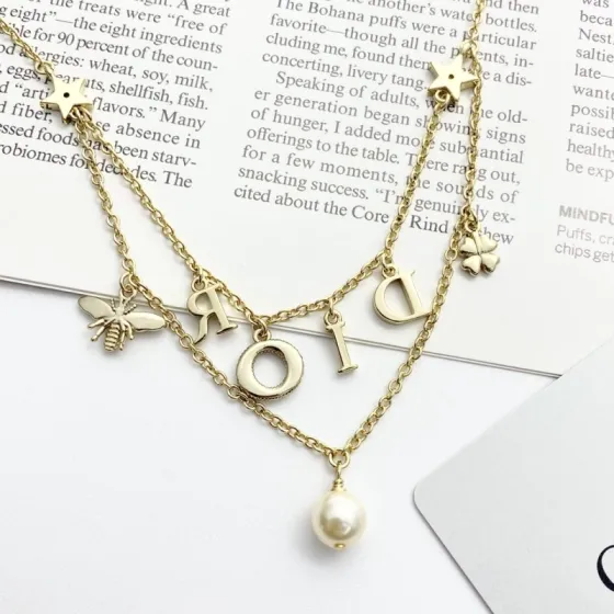 Dior Dio r evolution necklace gold-tone metal white faux pearl clear crystal 42cm with 5cm extender