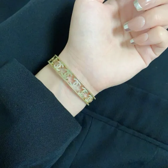 Chanel CC Logo Crystal Cutout Cuff bracelet Gold-tone metal with clear crystal accents One Size fits 15-17cm wrist