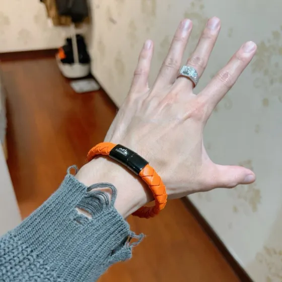 Hermes Braided Leather Clic Clac Bracelet bracelet Orange braided leather with black gunmetal-tone metal clasp 19cm