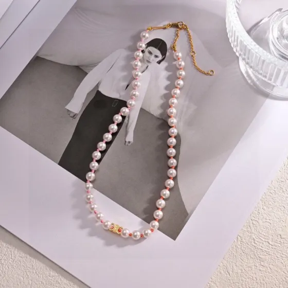 Celine Triomphe Pearl bracelet gold-tone metal white pearls pink and coral accent beads 18cm with 5cm extender chain